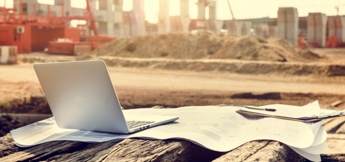 A laptop on a construction site representing the power of APIs